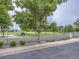 View of Prairie Ridge Park featuring a green space, trees, signage, and walking paths at 6447 St Vrain Ranch Blvd, Longmont, CO 80504