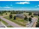 Charming single-Gathering home boasting a welcoming front porch and mature landscaping on a spacious lot at 895 Antelope W Dr, Bennett, CO 80102