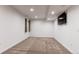 Unfurnished basement area featuring plush carpet and neutral walls at 895 Antelope W Dr, Bennett, CO 80102