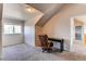 Bedroom with plush carpet, a large window, chair and a modern desk at 895 Antelope W Dr, Bennett, CO 80102