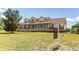 Spacious home with a large front yard and a 'For Sale' sign at 895 Antelope W Dr, Bennett, CO 80102