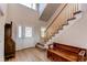 Inviting foyer with a staircase, bench, and hardwood floors at 895 Antelope W Dr, Bennett, CO 80102