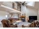 Cozy living room with a fireplace, vaulted ceiling, and comfortable seating at 895 Antelope W Dr, Bennett, CO 80102