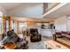 Spacious living room featuring an open floor plan, comfortable furniture, and natural light at 895 Antelope W Dr, Bennett, CO 80102