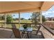 Relaxing porch area with outdoor seating and views of the well-maintained lawn and surrounding neighborhood at 895 Antelope W Dr, Bennett, CO 80102