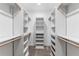 Well-organized walk-in closet with custom shelving and ample storage space at 895 Antelope W Dr, Bennett, CO 80102