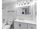 A bright bathroom is equipped with a shower/tub combo and a white vanity at 3613 S Sheridan Blvd # 7, Denver, CO 80235