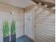Apartment 7 has a tidy front entrance with wood-look siding and greenery at 3613 S Sheridan Blvd # 7, Denver, CO 80235