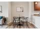 Dining area with a round table and four chairs, showcasing modern design and functionality at 1062 Rockhurst Dr # 401, Highlands Ranch, CO 80129