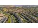 Expansive aerial view of the residential neighborhood featuring well-maintained homes and a nearby lake at 6310 S Ider St, Aurora, CO 80016