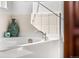 Close-up of a tiled tub with decor and sleek faucet fixtures in a relaxing bathroom setting at 6310 S Ider St, Aurora, CO 80016