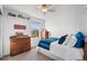 Bright bedroom with a ceiling fan, two dressers, and a charming window view at 6310 S Ider St, Aurora, CO 80016