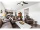 Comfortable living room featuring hardwood floors, ceiling fan and a beautiful kitchen view at 6310 S Ider St, Aurora, CO 80016