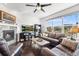 Inviting living room with fireplace, large windows, and comfortable seating arrangement at 6310 S Ider St, Aurora, CO 80016