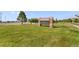 The sign for Pine Ridge Elementary is displayed amid a well-manicured lawn and trees at 6310 S Ider St, Aurora, CO 80016