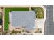 An aerial view of a house with a grey roof, driveway, and fenced backyard with a trampoline at 7814 Grady Cir, Castle Rock, CO 80108