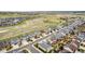 Scenic aerial view of a neighborhood surrounded by open space and walking trails on a sunny day at 7814 Grady Cir, Castle Rock, CO 80108