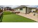 Backyard features manicured artificial grass and privacy fence at 7814 Grady Cir, Castle Rock, CO 80108