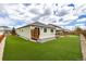 Lush backyard with artificial turf and wooden deck with seating area at 7814 Grady Cir, Castle Rock, CO 80108