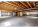 Large unfinished basement ready for customization with exposed wood ceiling at 7814 Grady Cir, Castle Rock, CO 80108