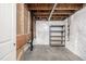 Unfinished basement space with white vapor barrier and utility connections at 7814 Grady Cir, Castle Rock, CO 80108