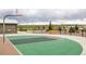 Community basketball court featuring a well-kept green court, basketball hoop, and adjacent bench seating at 7814 Grady Cir, Castle Rock, CO 80108