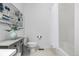 Bathroom featuring a vanity, toilet, decorative wall art, and a shower-tub combo at 7814 Grady Cir, Castle Rock, CO 80108