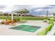 Community common area featuring picnic tables, seating, and a four square court for community gatherings at 7814 Grady Cir, Castle Rock, CO 80108