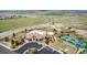 An aerial view of a neighborhood community center with tennis courts, playground and a parking lot at 7814 Grady Cir, Castle Rock, CO 80108