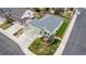 Aerial view of green home highlighting the front lawn, three car garage and well manicured landscaping at 7814 Grady Cir, Castle Rock, CO 80108
