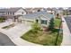 Charming, well-maintained green home with a three-car garage, manicured lawn, and established landscaping at 7814 Grady Cir, Castle Rock, CO 80108