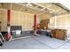 Spacious garage with tall ceilings, car lift, and built-in storage cabinets at 7814 Grady Cir, Castle Rock, CO 80108