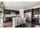 Modern kitchen featuring granite countertops, stainless steel appliances, and a center island with seating at 7814 Grady Cir, Castle Rock, CO 80108