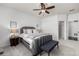 Tranquil main bedroom featuring a plush bed, modern decor, and an ensuite bathroom with a walk-in closet at 7814 Grady Cir, Castle Rock, CO 80108