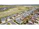 An aerial view of a neighborhood surrounded by open space and walking trails on a sunny day at 7814 Grady Cir, Castle Rock, CO 80108