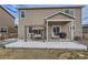 Home's backyard featuring a patio with a seating area and grill at 14799 Longhorn Dr, Mead, CO 80542