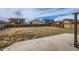 Spacious backyard featuring a large grassy area and concrete patio at 14799 Longhorn Dr, Mead, CO 80542