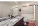 Bathroom featuring granite countertop vanity, sink, and shower with striped curtain at 14799 Longhorn Dr, Mead, CO 80542