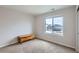 Neutral bedroom with a window, carpeted floors, and chest at 14799 Longhorn Dr, Mead, CO 80542