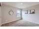 Neutral bedroom with a window, carpeted floors and mountain themed decor at 14799 Longhorn Dr, Mead, CO 80542