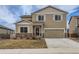 Charming two-story home with stone accents, a two-car garage, and a welcoming front door with a wreath at 14799 Longhorn Dr, Mead, CO 80542