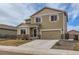 Charming two-story home with stone accents, a two-car garage, and a welcoming front door with a wreath at 14799 Longhorn Dr, Mead, CO 80542