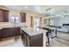 Modern kitchen featuring granite countertops, island with seating, and stainless steel appliances at 14799 Longhorn Dr, Mead, CO 80542