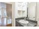 Modern bathroom with granite countertop and a spacious shower at 2692 Front View Cres, Denver, CO 80211