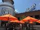 Outdoor seating area with orange umbrellas near ice cream shop at 2692 Front View Cres, Denver, CO 80211