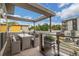 Modern rooftop patio with seating area and city views at 2692 Front View Cres, Denver, CO 80211