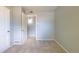 The bedroom has neutral walls and carpet, plus direct access to a closet at 1099 Wheeling St, Aurora, CO 80011