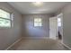 Bright bedroom with neutral carpet, freshly painted gray walls and a convenient ensuite bathroom at 1099 Wheeling St, Aurora, CO 80011