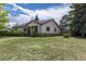 Charming single-story home with a well-maintained lawn, mature trees, and welcoming curb appeal at 1099 Wheeling St, Aurora, CO 80011
