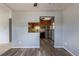 View of the kitchen from the dining room with wood cabinets and stainless appliances at 1099 Wheeling St, Aurora, CO 80011